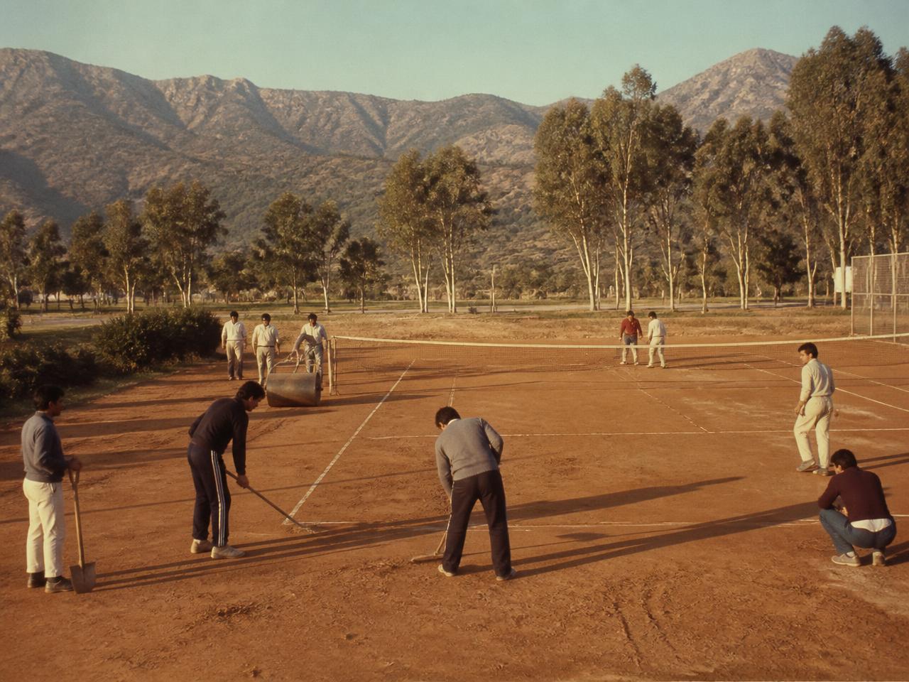 Volunteers rolling and marking the clay court in F-6/3 in the early 1980s